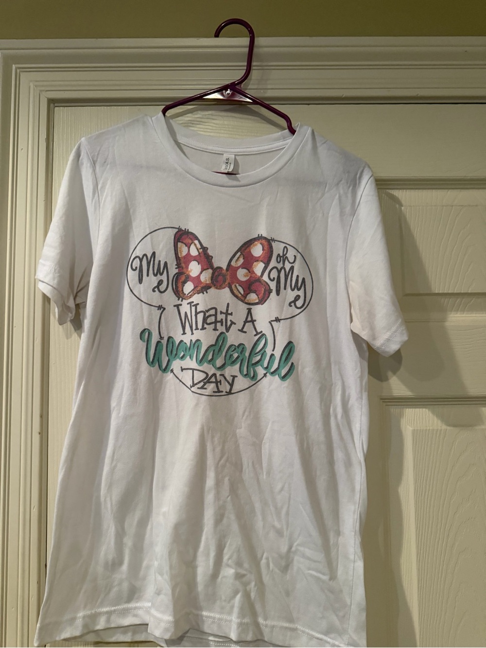 Bella Canvas White Short-Sleeve Tee with Pink Polka-Dot Bow and Teal Script
